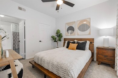 Bedroom featuring carpet flooring and ceiling fan