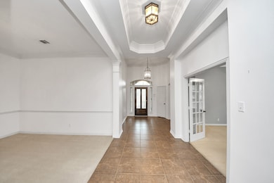 As you enter, you'll see the dining room sits to t
