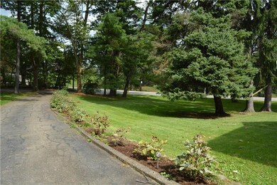 Beautifully lined wrap around paved driveway.