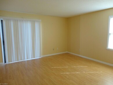 Large 15 X 15 Living Room. Sliding Door overlooks Patio.