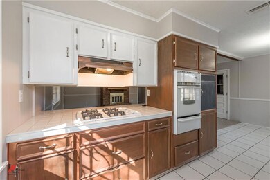 Kitchen contains a large amount of cabinets.