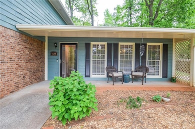 Property entrance with covered porch