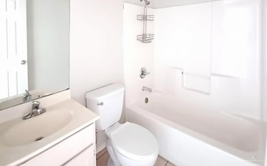 Full bath featuring shower / bathtub combination and vanity