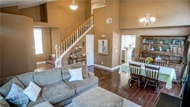 Living room and formal dining, maple hardwood floors throughout, updated lighting fixtures, newer paint