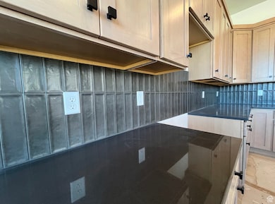 Kitchen with tasteful backsplash