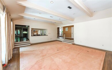 This view of the living room looks to the entry, w
