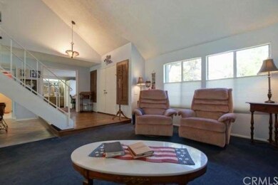 Light, bright open living room leads to formal din