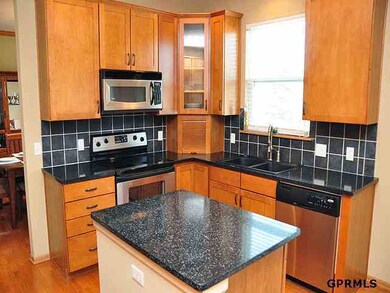 Ceramic backsplash, stainless appliances, appliance garage.