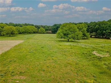 View of yard with a rural view