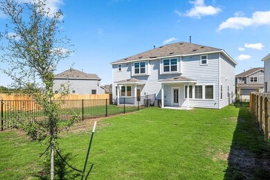 Back of property with a patio area and a fenced backyard