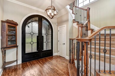 As you enter the foyer from the Beautiful Custom made Doors