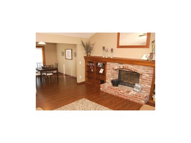 The wood floors continue to the dining room.