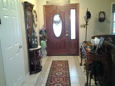 New front door. Ceramic flooring