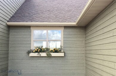 Cherry window box outside of kitchen sink.