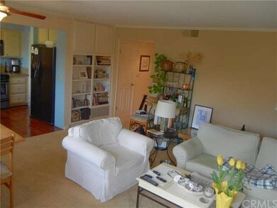 The living room opens into the kitchen