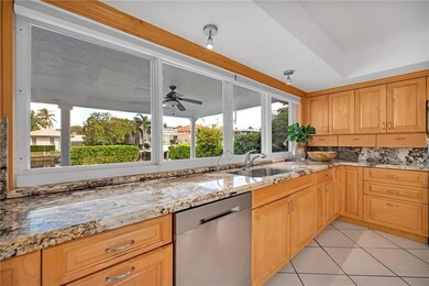 Big kitchen with granite, stainless and eat-in bar