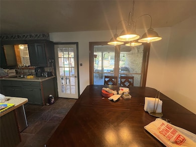 Dining area with a chandelier