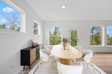 The virtually staged dining room has an abundance of natural light.