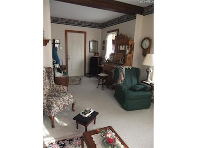 Country sized living room with large windows and b