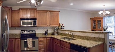 Granite kitchen with SS appliances and new subway tile back splash.