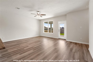 Spare room with light wood-style floors and ceiling fan