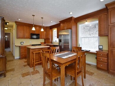 Kitchen with ample storage and desk/work area.
