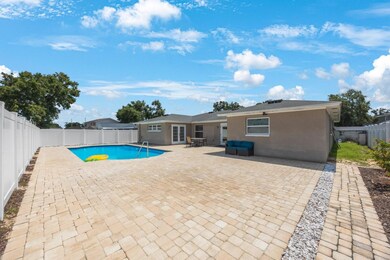 Paved back yard with the big pool!