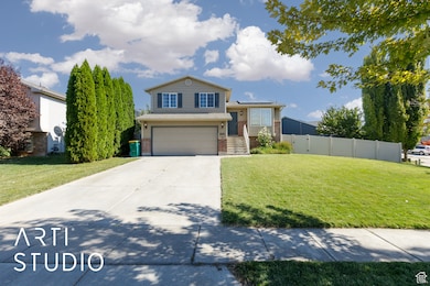 View of front of house featuring brick siding, driveway, and an attached garage