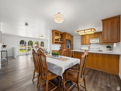 Dining area featuring dark wood finished floors and baseboards