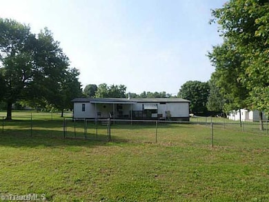 Exterior Back. fenced area back view of home