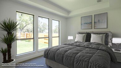 Bedroom with multiple windows, carpet, and visibl