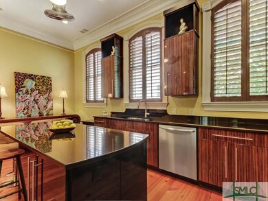 Breakfast bar with black granite countertops and t