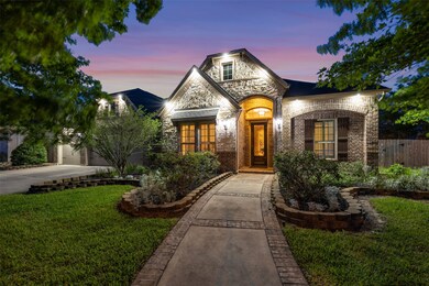 Upon arrival, you are immediately greeted by lush landscaping and a paved walk way leading up to the grand front entry of the home.