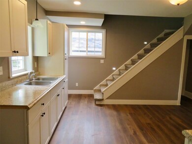 New kitchen cabinets, stairway to second floor
