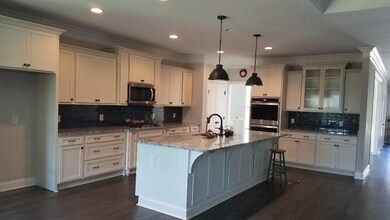 Enormous kitchen with tons of cabinets.  Cabinets at the back of the bar even open!  Lots of bar seating.
