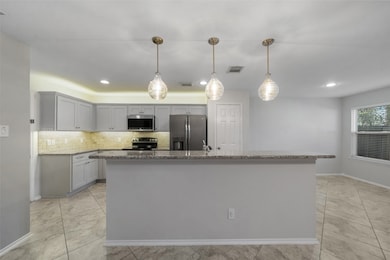 Enjoy a stunning view of the kitchen, featuring ne