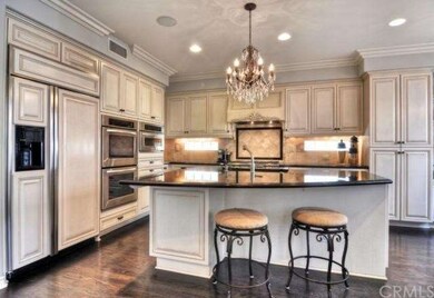 Remodeled kitchen with granite countertops.