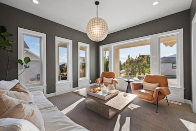 Sitting room with recessed lighting, healthy amount of natural light, and carpet flooring