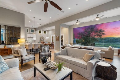 Living area with light wood-style flooring, a cei