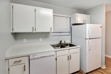 White Paint Cabinet and Kitchen Faucet
