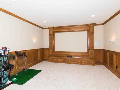 Home Theatre. Home theater has mood lighting and beautiful wood paneling
