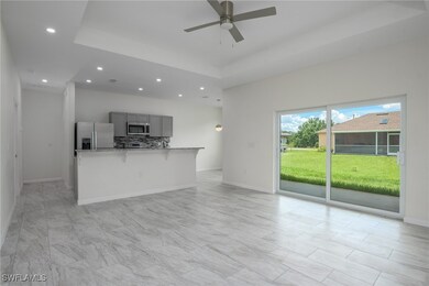 Living room featuring ceiling fan, recessed lighti