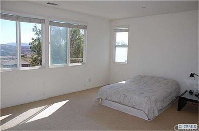 The master bedroom is very large and has beautiful