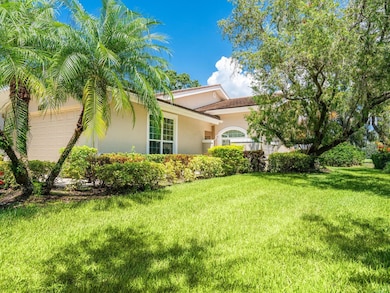 Large two car garage with finished flooring. Paver driveway with sidewalk leading to gated from entry patio with travertine tiles, perfect for barbecue!