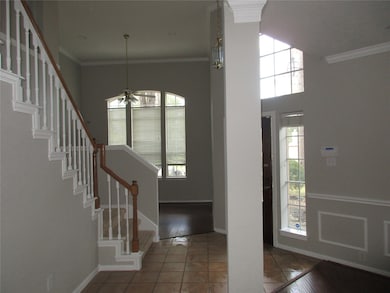 Tile entry floors, den and formal dining with dram