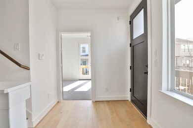 To your right, a bedroom awaits, enhanced by crisp