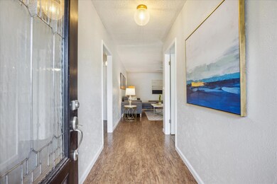 Entrance foyer featuring wood finished floors and