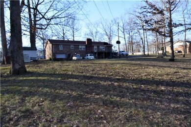 Large back yard with plenty of room to roam. 1 car garage with full unfinished basement. Would make a great workshop! Deck needs work. Fireplace in basement can heat the whole house!