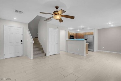 Unfurnished living room with ceiling fan