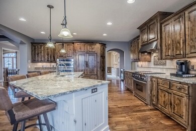 Gleaming hardwood flooring throughout foyer, livin